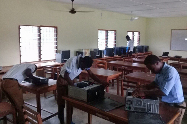 Students learning computer maintenance at Tetrefu ICCES, Ghana